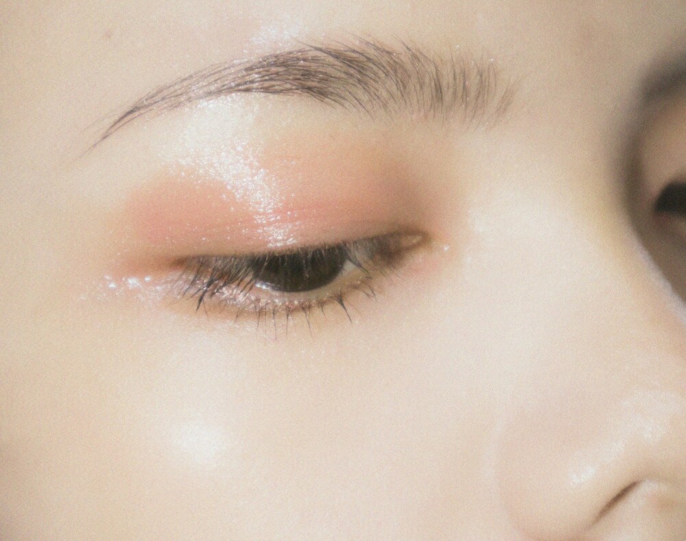 A close up of a woman's eye with makeup